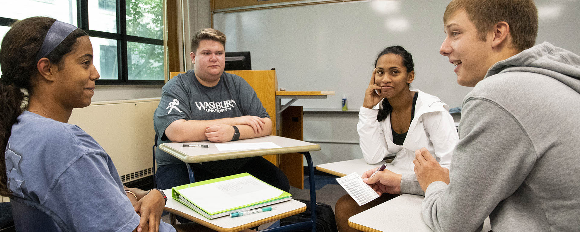 Students talk during a class discussion